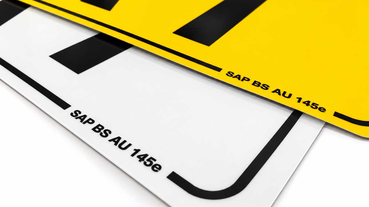 Yellow and white number plates, each carrying the SAP BS AU 145e supplier mark